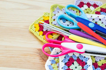 Concept of a woman's hobby. Knitting and work at home. Knitting..Multicolored balls of yarn, scissors, knitting needles, hooks. Materials for creativity and crafts. Copy space.