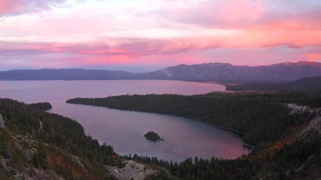 Aerial view over Emerald Bay in Lake Tahoe, California USA after sunset during twilight with the colorful sky reflection on the water below.