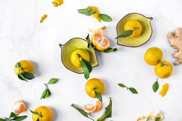 Still life of tangerines. Mandarin lies in the composition in a bowl and over the background. Citrus, holiday mood. FlatLay
