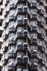 Bicycle wheel and tire close up on tread abstract. Macro