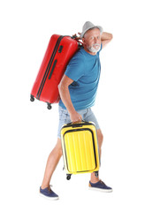 Senior man with suitcases on white background. Vacation travel