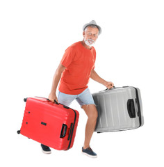 Senior man with suitcases on white background. Vacation travel