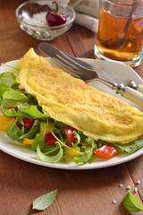 Omelet stuffed from arugula, sweet pepper, vertical