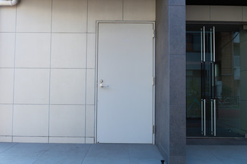 sidewalk by street wall & door