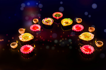 Happy Diwali Diya lamps lit during diwali celebration