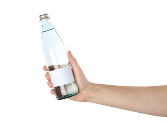 Man holding glass bottle of pure water with blank tag on white background
