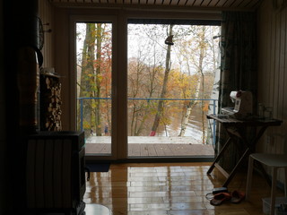 View from the window on the autumn landscape, home interior