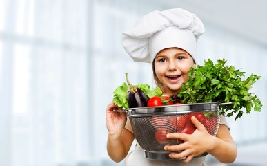 Portrait of adorable little girl preparing healthy