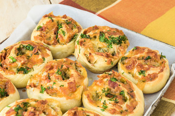 Homemade cheesy bacon holiday rolls.