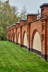 Brick fence on the grass