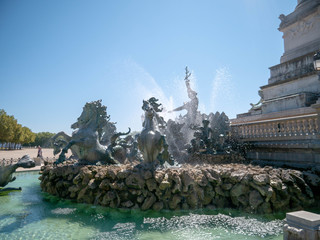 Horses bursting out of the water in a fountain at Place des Quinconces, Bordeaux, France