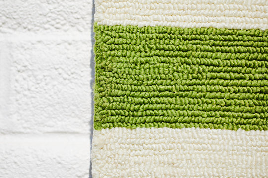 Close up of a green and beige mat