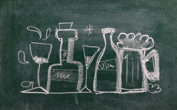 Bottle and glasses symbol, sign on chalkboard, blackboard texture