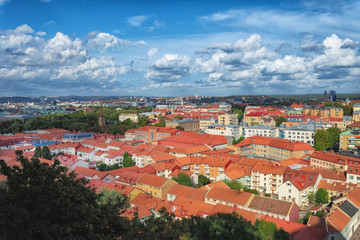 Picture of european city overview from the top with blue sky and clouds