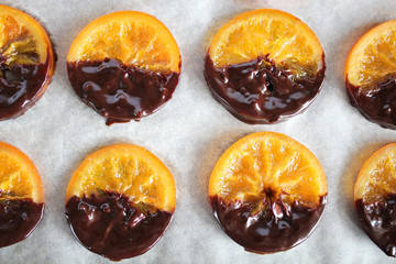 Preparation of dried orange by the recipe, step by step.Step four to smear oranges with chocolate. Dried Oranges Christmas decoration. Christmas composition.