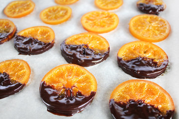 Preparation of dried orange by the recipe, step by step.Step four to smear oranges with chocolate. Dried Oranges Christmas decoration. Christmas composition.