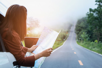 women travel relax in the holiday. traveling by car with trendy look searching direction on...