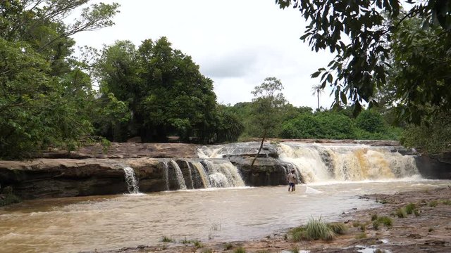Man fishing around the Farako falls in Mali, Africa