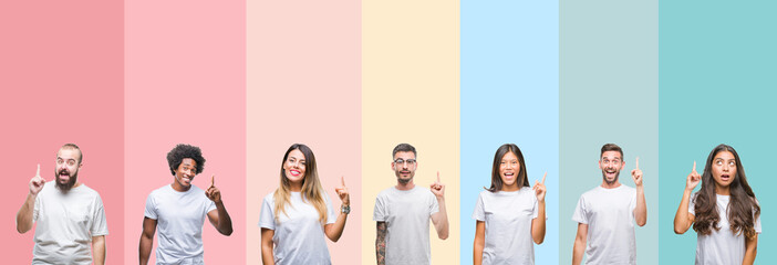 Collage of different ethnics young people wearing white t-shirt over colorful isolated background pointing finger up with successful idea. Exited and happy. Number one.