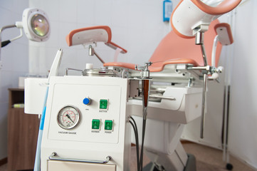 Gynecological cabinet with chair and other medical equipment in modern clinic