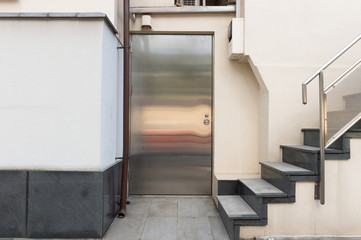 sidewalk by street wall & door