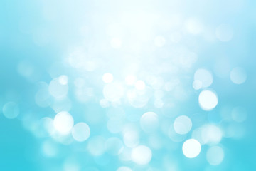 Abstract colorful blur blue texture background with white and blue bokeh circles in soft color style. Template for underwater backdrop or winter design illustration. © Olga