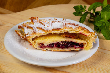Cherry strudel in the plate