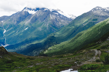 Fototapeta premium Lovely view of mountains and rolling hills, and glaciers along the Trail of '98 in Valdez Alaska along the Richardson Highway