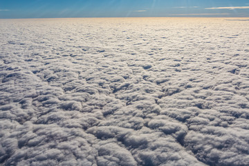 above the clouds - endless view of clouds covering the earth 