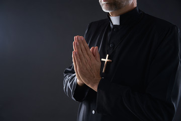 Praying hands priest portrait of male - obrazy, fototapety, plakaty