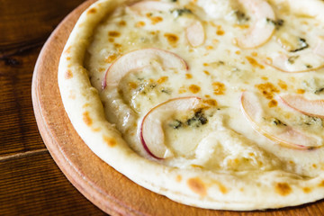 delicious pizza with meat, cheese and mushrooms	