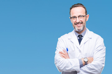 Middle age senior hoary professional man wearing white coat over isolated background happy face smiling with crossed arms looking at the camera. Positive person. - Powered by Adobe