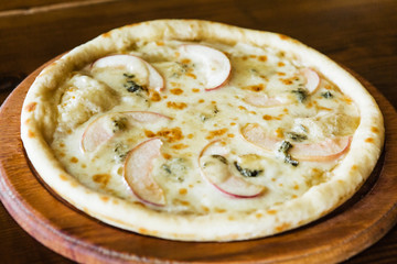 delicious pizza with meat, cheese and mushrooms	