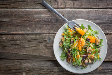 Healthy salad of vegetables - tomatoes, arugula, eggplant