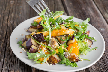 Healthy salad of vegetables - tomatoes, arugula, eggplant