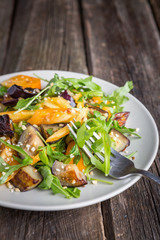 Healthy salad of vegetables - tomatoes, arugula, eggplant