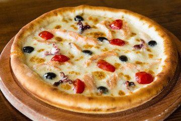 delicious pizza with meat, cheese and mushrooms	