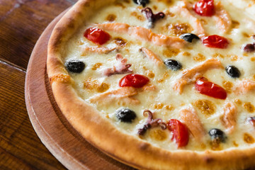 delicious pizza with meat, cheese and mushrooms	