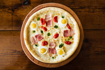 delicious pizza with meat, cheese and mushrooms	