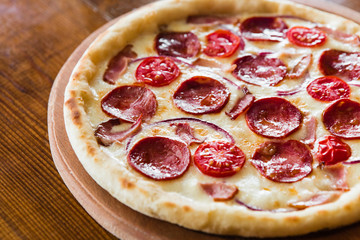 delicious pizza with meat, cheese and mushrooms	