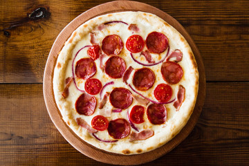 delicious pizza with meat, cheese and mushrooms	