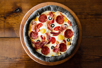 delicious pizza with meat, cheese and mushrooms	