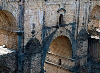 Fototapeta na wymiar Roman bridge of four arches located in the town of Ronda in the Spanish province of Malaga