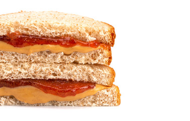 A Classic Peanut Butter and Strawberry Jelly Sandwich on Wheat Bread