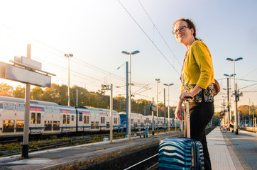 Young woman waiting for the train in Europe