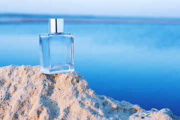 ..Perfume bottle on blue background - obrazy, fototapety, plakaty