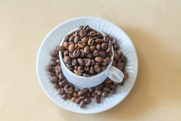 coffee beans in a white cup