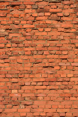 wall from an old red brick which collapses