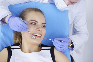 beautiful girl in the dental chair on the examination at the dentist
