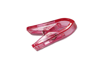 plastic pink pin for sewing isolated on white
